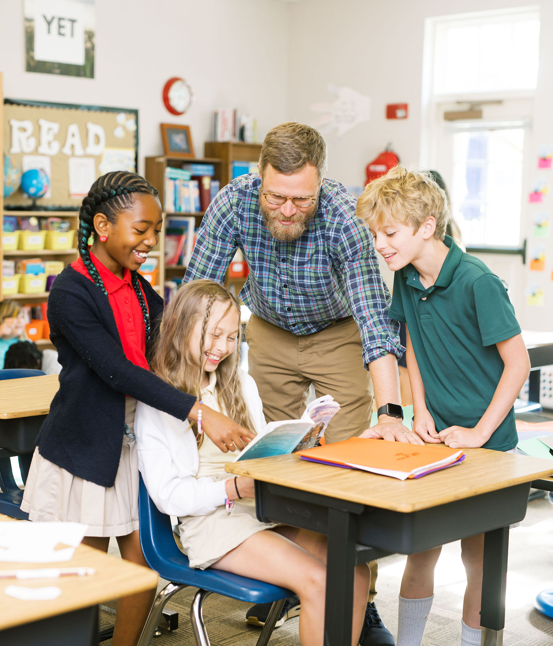 Teacher working with students at Canterbury
